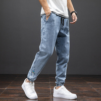 Wiosna lato czarne niebieskie dżinsy Cargo mężczyźni Streetwear Denim spodnie do biegania mężczyźni Baggy Harem Jean spodnie Plus rozmiar 6XL 7XL 8XL 2